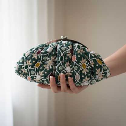Embellished clutch held in hand